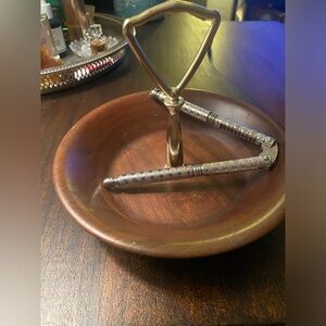 Mid century modern walnut nut bowl with a nut cracker.
